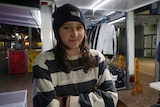 A young teenage girl wearing a stripy top and beanie is a Care4Coast volunteer.