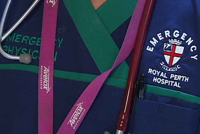 A close up of a doctor wearing an emergency department uniform with a stethoscope around her neck.