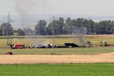 Wreckage of a military transport plane after crashing near Seville