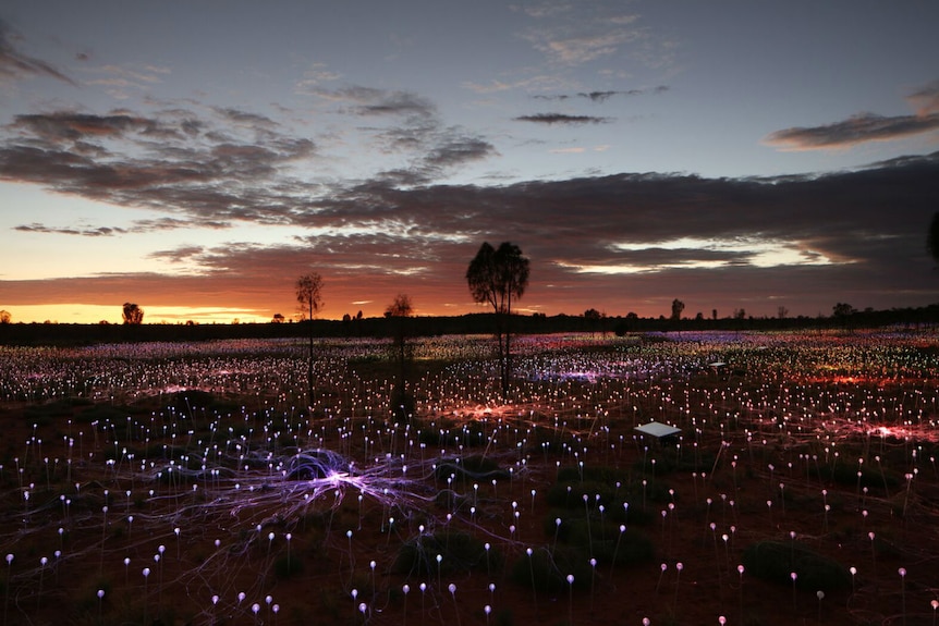 A light show at Uluru at sunset