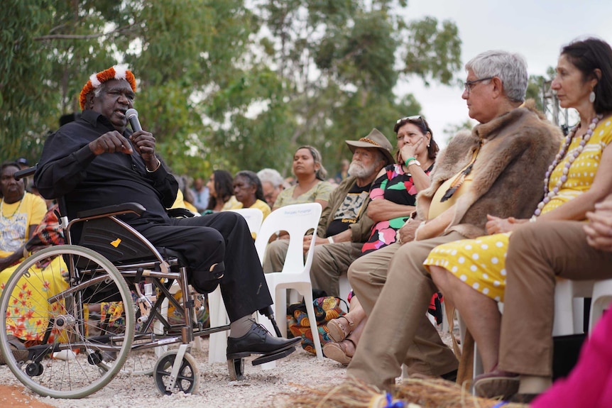 Dr Yunupingu faces the Minister for Indigenous Australians, Ken Wyatt, while Jack Thompson looks on.