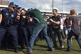 Riot police face off against mock protesters in preparation for the real thing. Thur May 22, 2014