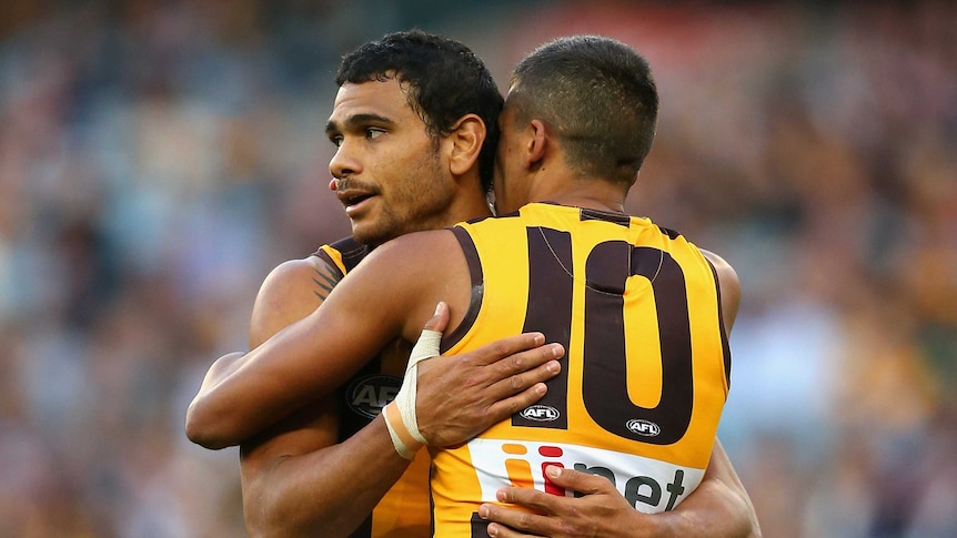 Cyril Rioli (L) is congratulated by Bradley Hill after his goal for Hawthorn against Richmond.
