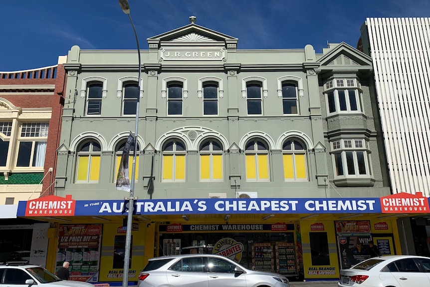 A chemist franchise inside an old building facade.