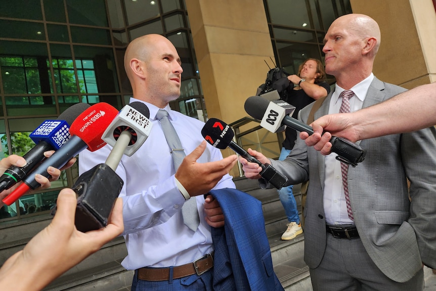Neo-Nazi Thomas Sewell outside Melbourne Magistrates Court talking to reporters