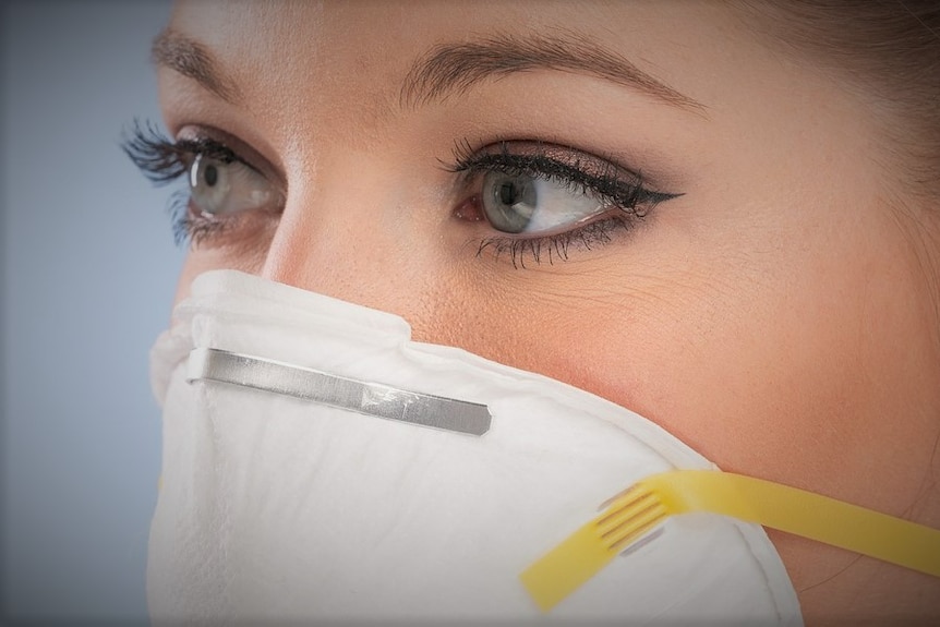 Female wearing respiratory mask.