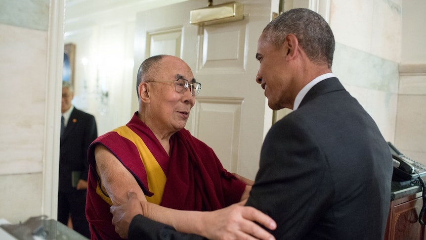 President Barack Obama greets the Dalai Lama.