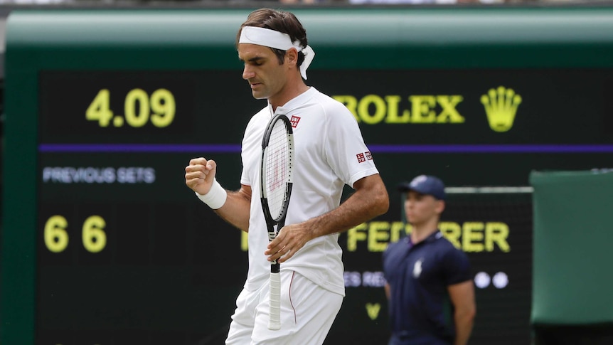 Roger Federer celebrates his match point against Lukas Lacko on day three of Wimbledon 2018.