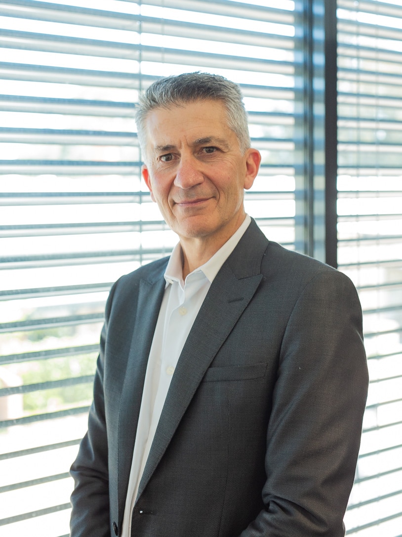 John Falzon looking into the camera in a portrait.