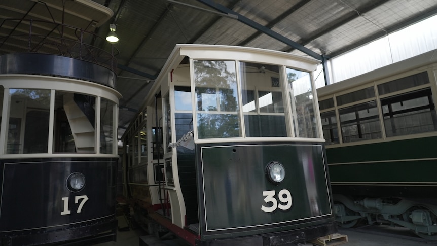 Restored trams 17 and 39 are seen here, painted white and dark green.