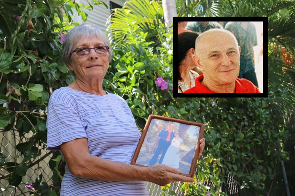 Judy Dent holds a photo of her husband Bob