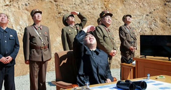 North Korean leader Kim Jong-un supervising launch of the Hwasong-14 missile.