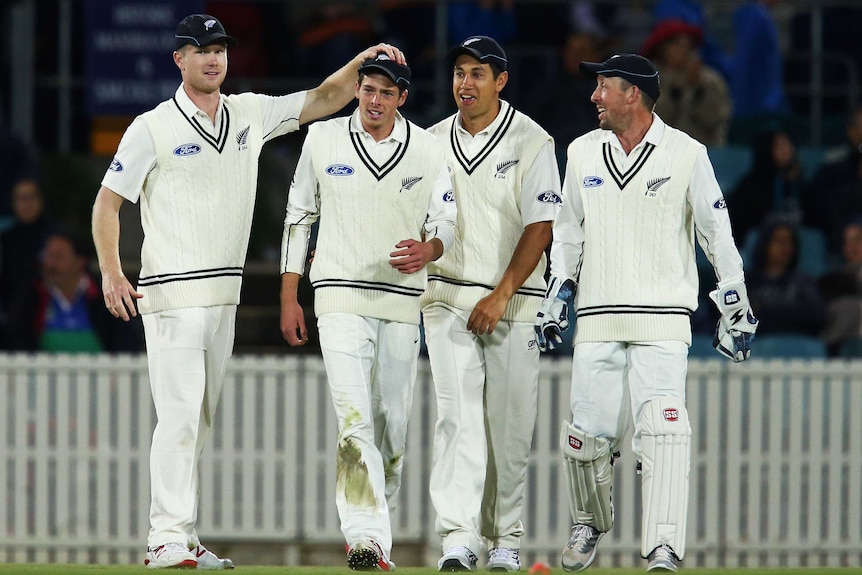 Mitchell Santner is congratulated after catching out Ashton Agar