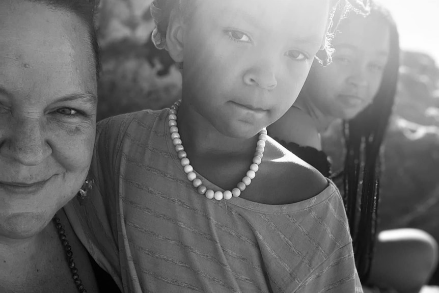 A black and white photo of a woman and child