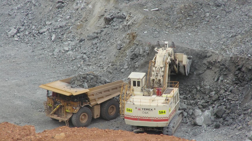 Excavator and dump truck