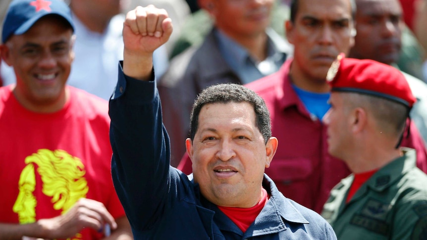 Venezuelan president Hugo Chavez waves to supporters after casting his vote during the election in Caracas.