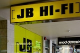People outside a JB Hi-Fi store in Brisbane