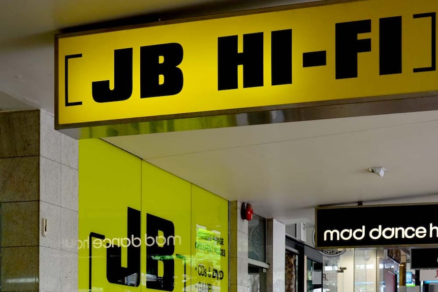 People outside a JB HI-FI store in Brisbane