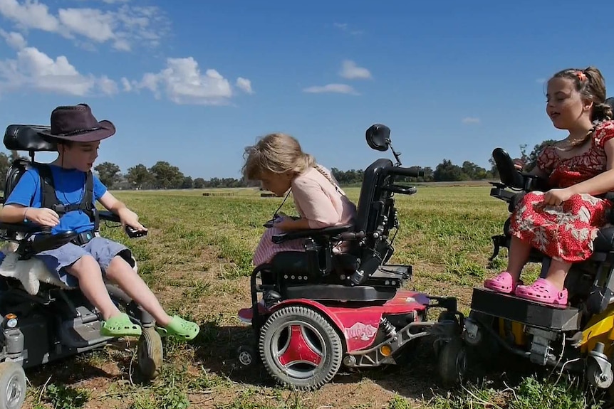 Triplets Gideon Read, Mahalah Read and Anwen Read make use of the space available in an empty field.