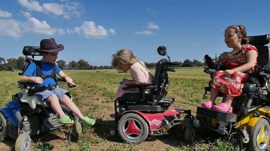 Triplets Gideon Read, Mahalah Read and Anwen Read make use of the space available in an empty field.