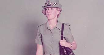 Jennifer Milligan in female police officer uniform 1983