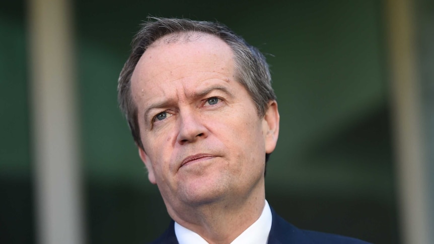 Bill Shorten listens to a question