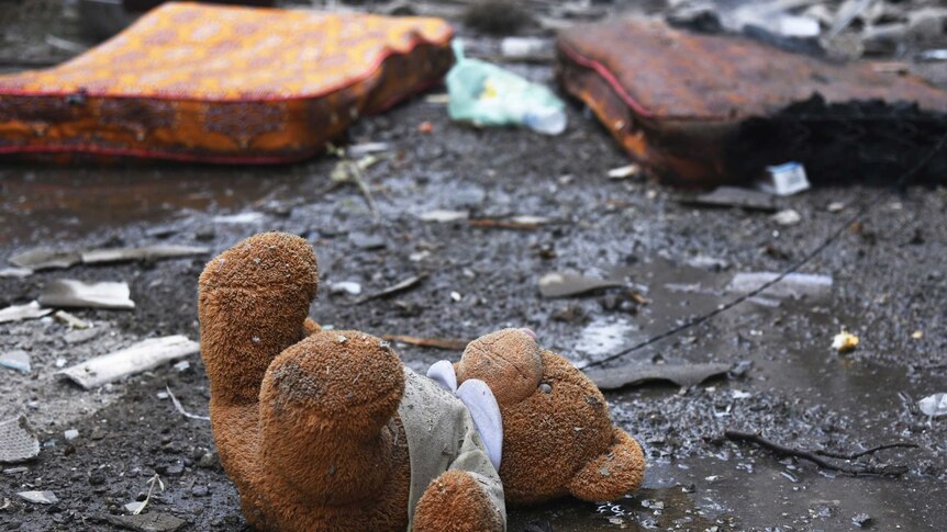 A teddy bear lies among damage in a residential area after shelling by Azerbaijan's artillery.