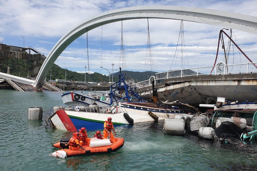 Taiwan bridge collapsing with a fisherman's boat trapped underneath.