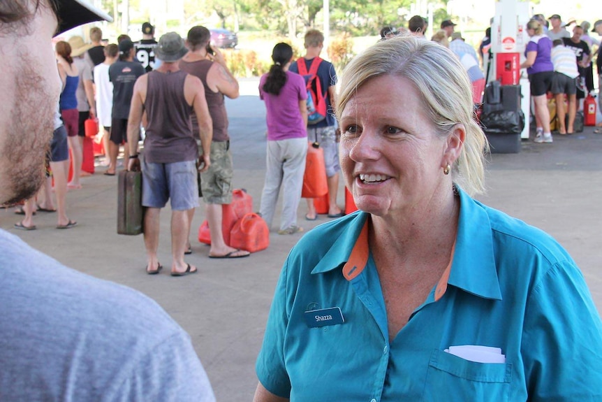 Shazza Clarke, owner of the only functioning petrol station in Rockhampton, talks to media