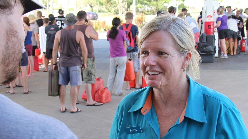 Shazza Clarke, owner of the only functioning petrol station in Rockhampton, talks to media