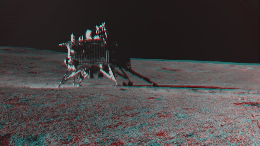 Red and blue tinted image of a rover on the moon 