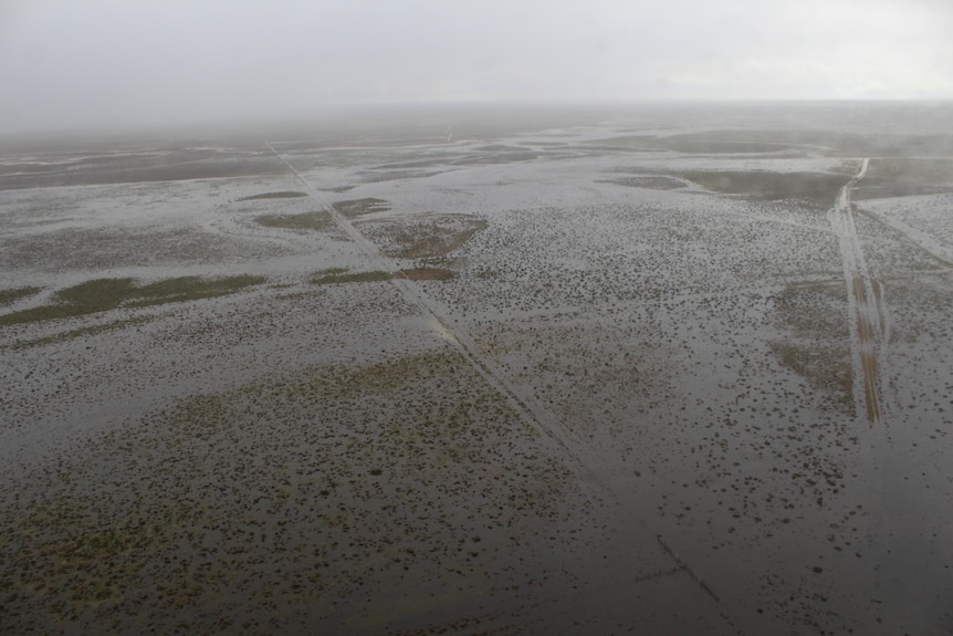 An aerial shot of a lot of floodwater over a large, flat area