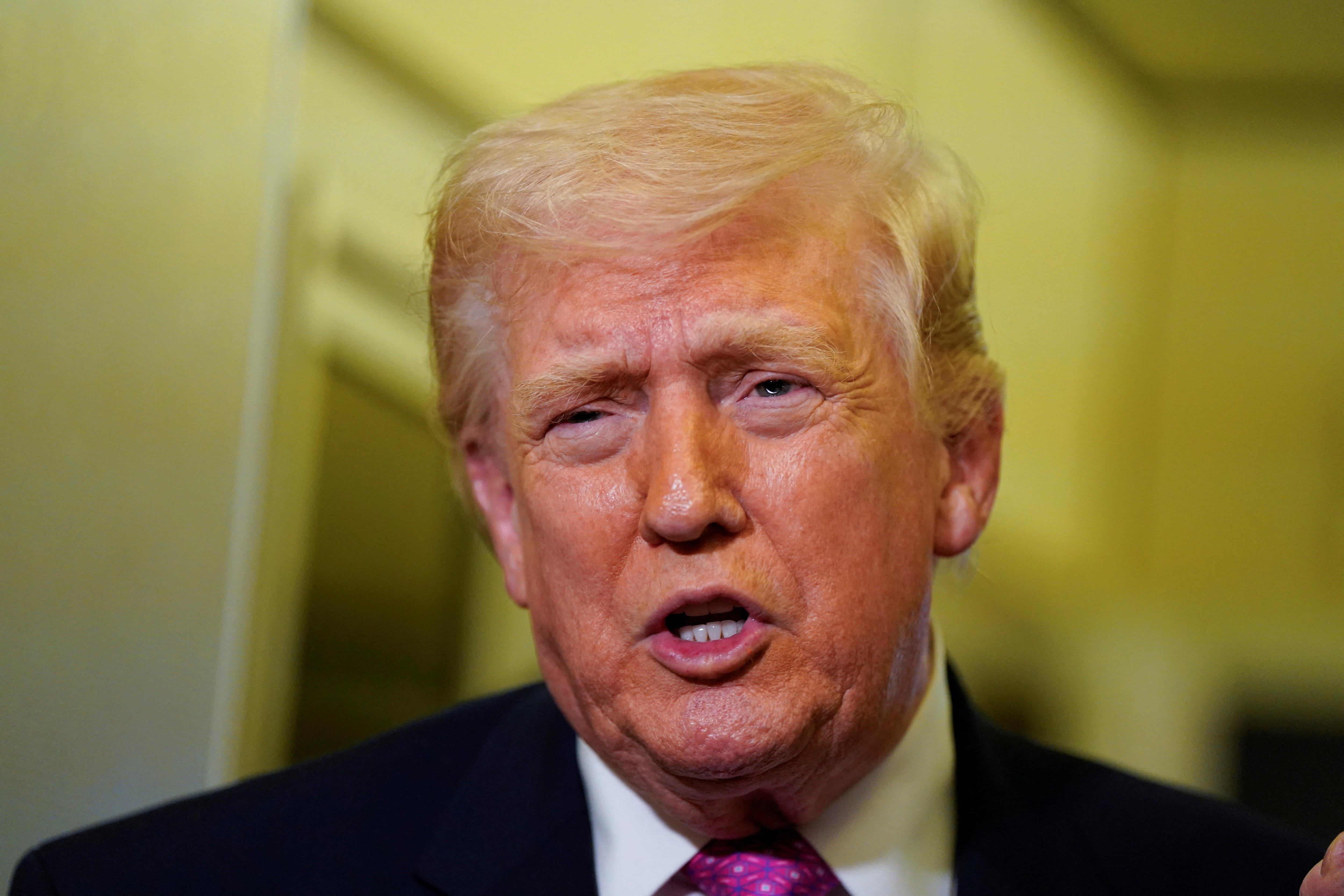 Live: Trump wants to 'take the oil' in Iran, as PM urges service stations to 'do the right thing'