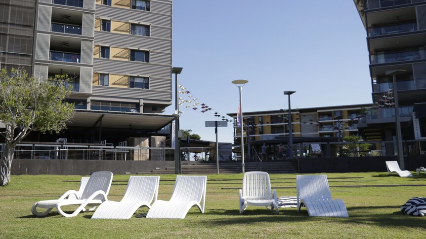 A group of empty sun lounges in a deserted section of the Darwin waterfront.