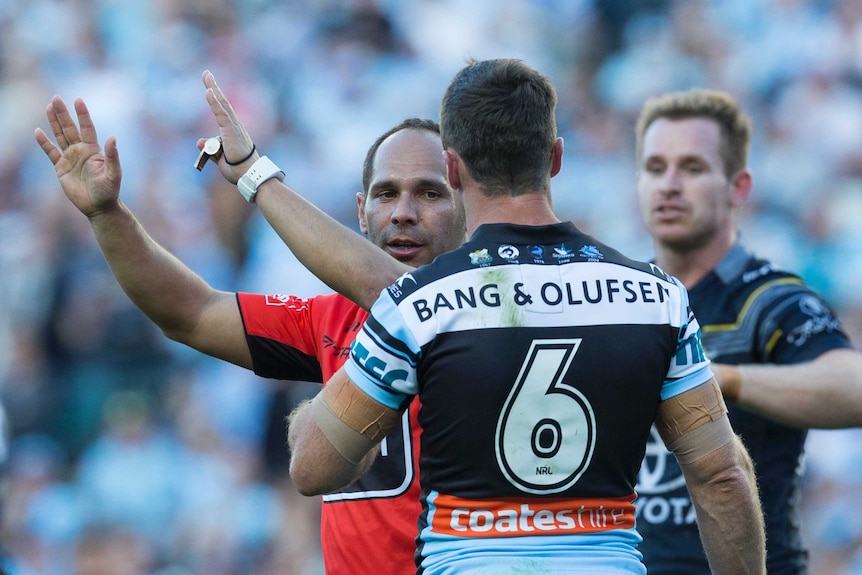 Assistant referee Ashley Klein sends the Sharks' James Maloney to the sin-bin against the Cowboys.