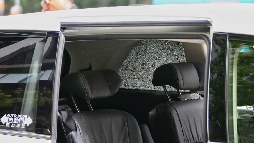 A shattered window in a car that was sprayed by concrete in Southbank.