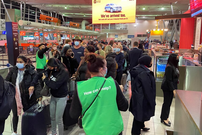 Passengers queue at Sydney Airport