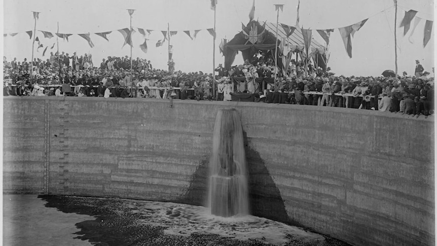 An historic black and white photograph of a new water reservoir opening in 1903.  