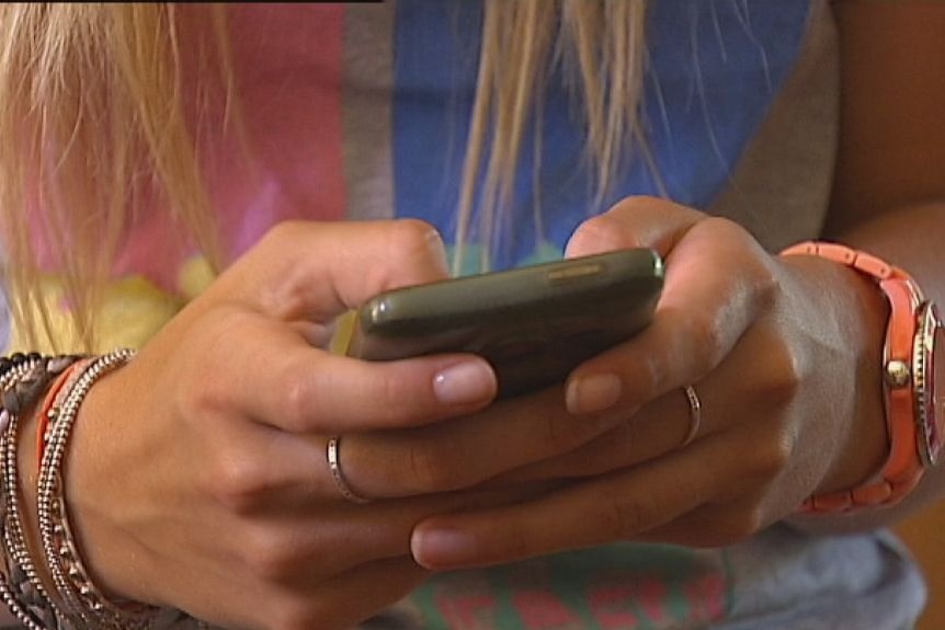 Generic image of a young female uses a mobile phone