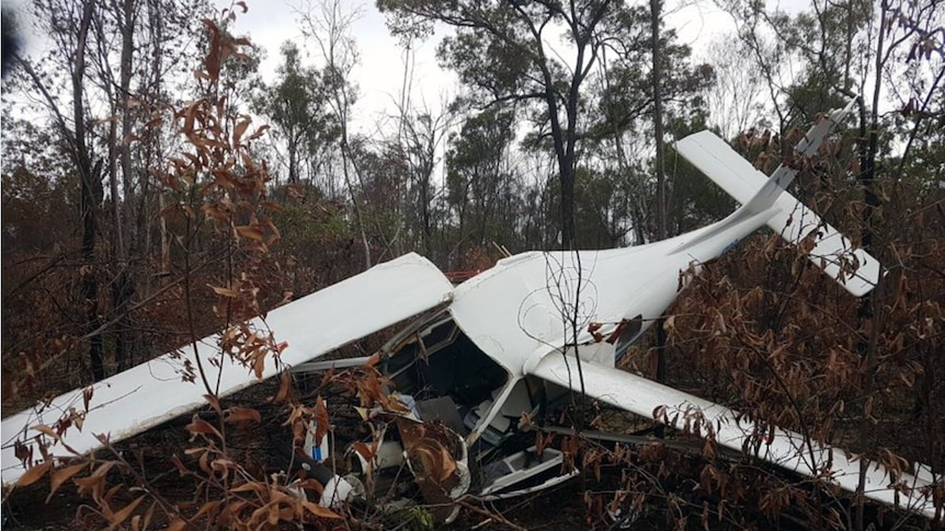 Wreckage of a crashed aircraft lies in bushland near Bundaberg in Queensland.