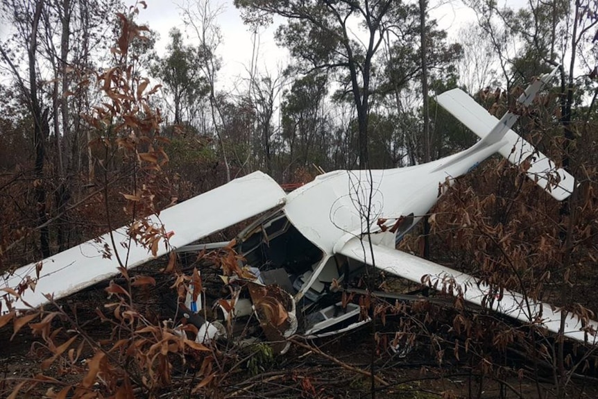 Wreckage of a crashed aircraft lies in bushland near Bundaberg in Queensland.