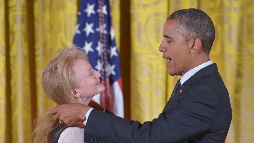 US President Barack Obama presents the National Humanities Medal to radio host Krista Tippett.