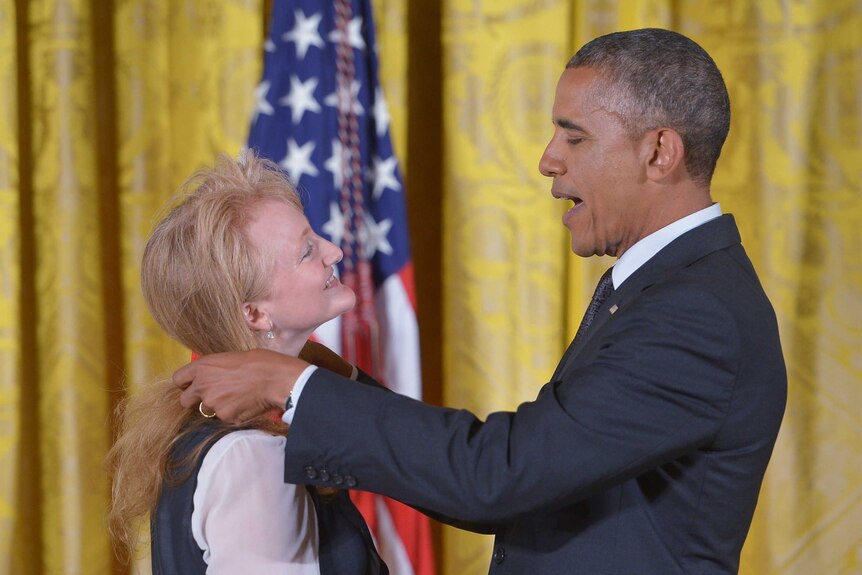 US President Barack Obama presents the National Humanities Medal to radio host Krista Tippett.