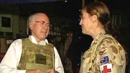 John Howard speaks to a soldier in Iraq