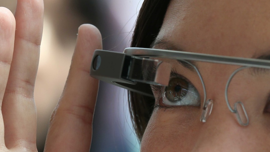 A woman tries Google Glass during the Google I/O developer conference on May 17, 2013 in San Francisco.