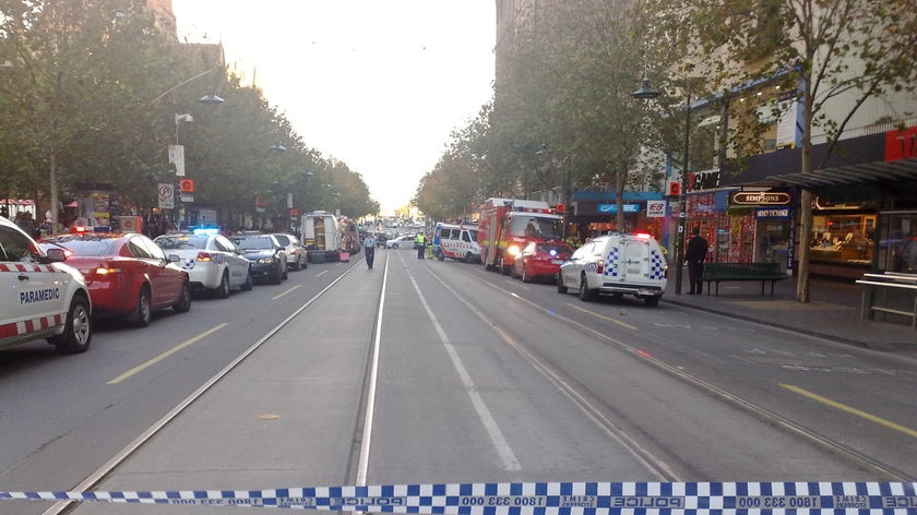 'Stay indoors': police cordon off Collins Street.