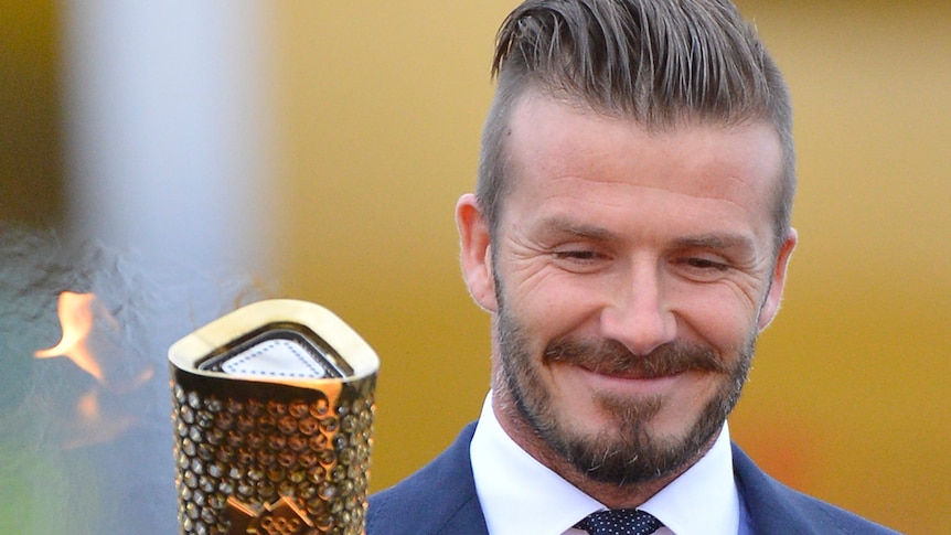 Faded dream ... David Beckham lights the Olympic torch in Cornwall last month