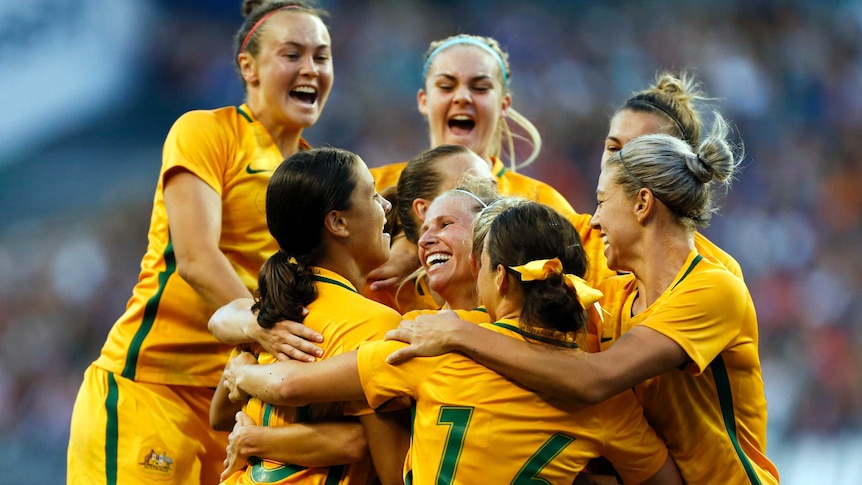 Australia's women's football team celebrate Tameka Butt's winning goal against USA in Seattle in July 2017