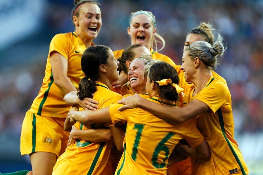 Australia's women's football team celebrate Tameka Butt's winning goal against USA in Seattle in July 2017