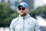 Brendon McCullum stands in England kit